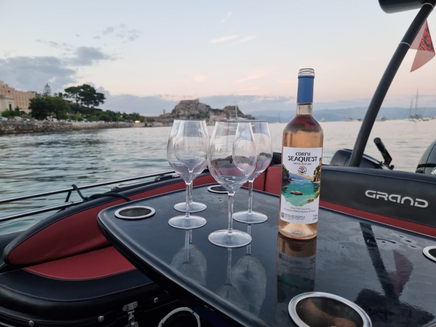 Rosé wine and glasses on the deck of the Grand RIB during a Corfu cruise